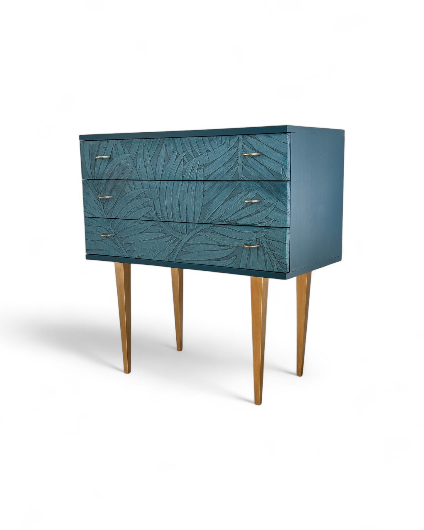 Vintage cabinet covered with the graceful leaves of the Sabal palm in relief | The Vintage Vibe